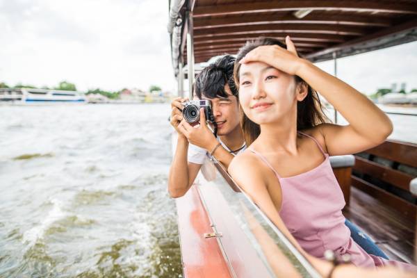 Two tourists enjoying a boat tour