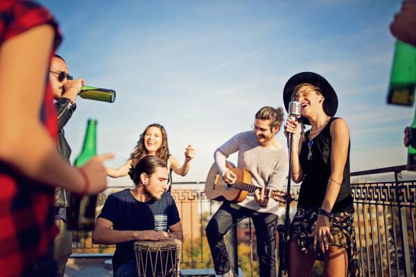 A band plays on a rooftop bar